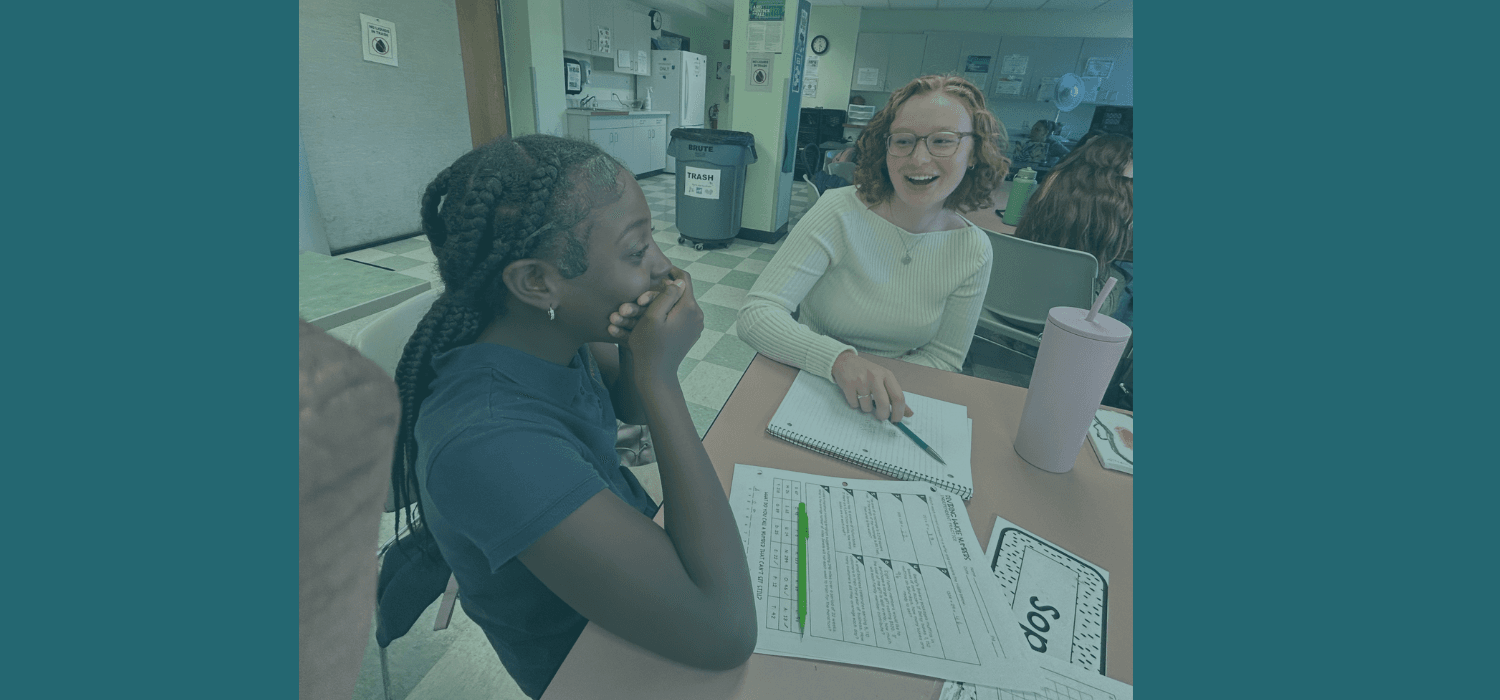 A young girl and her tutor are surprised