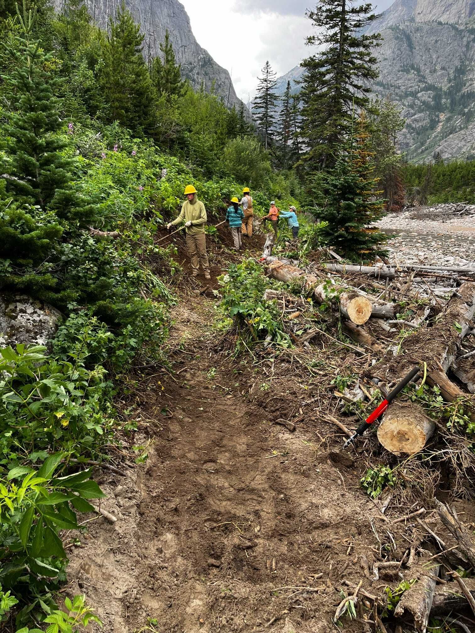 A photo of a crew working on a trail