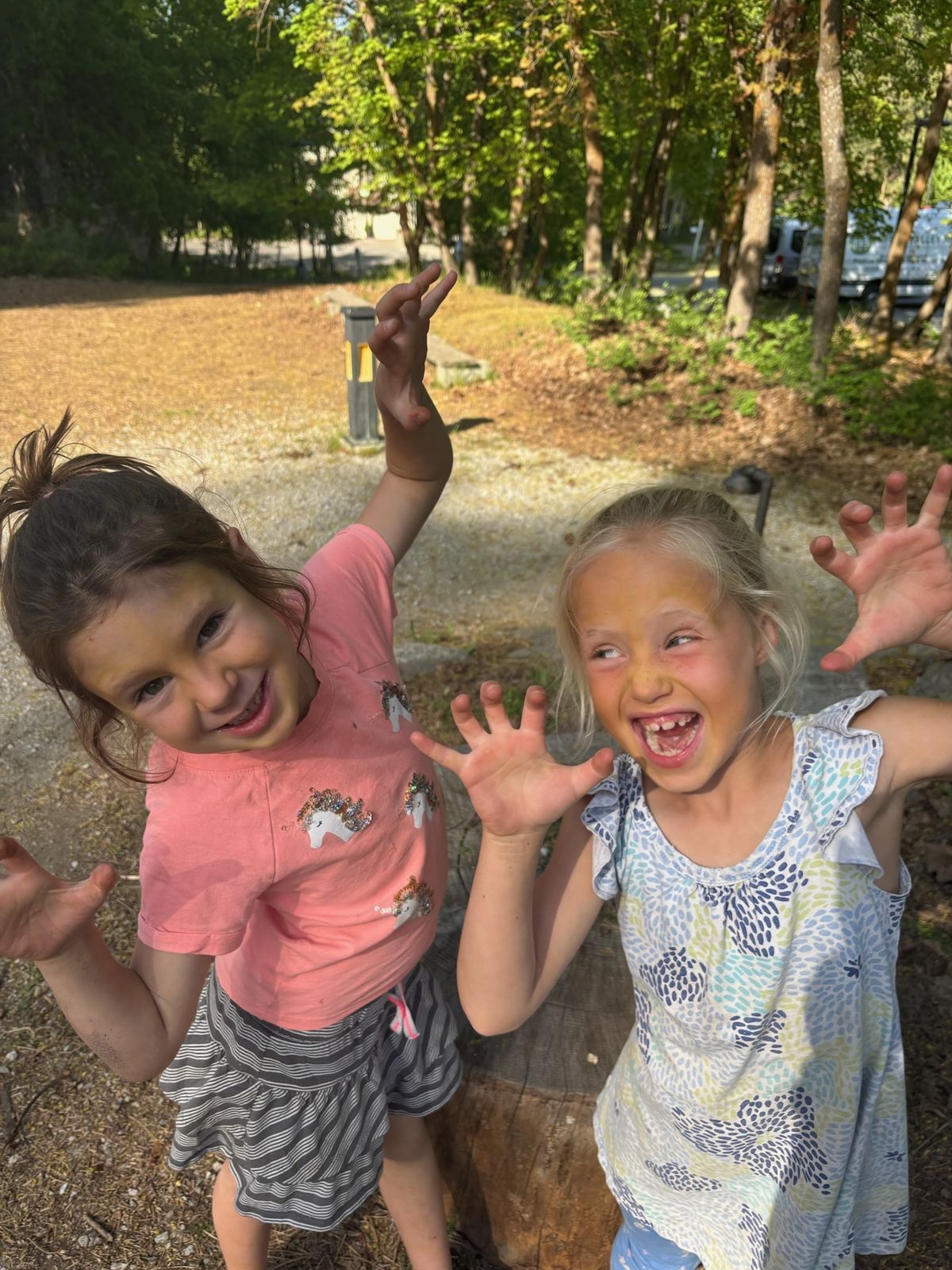 Two girls make goofy faces at the camera at WRI.