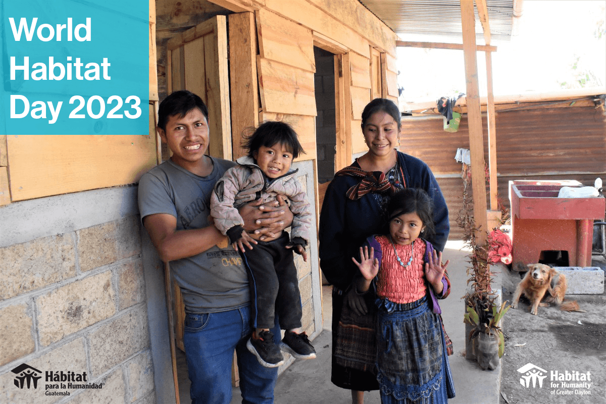Family in Guatemala poses in front of their new home. 