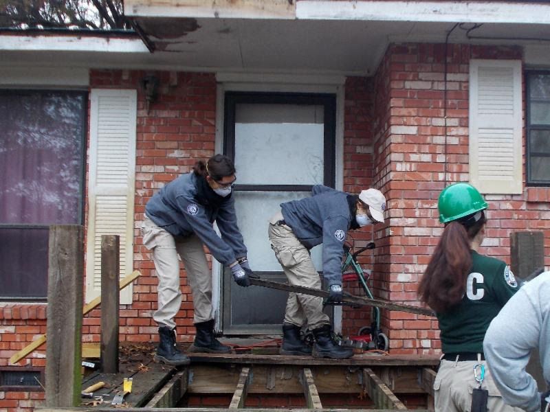 AmericaCorps Volunteers Make Progress on a Porch and Wheelchair Ramp