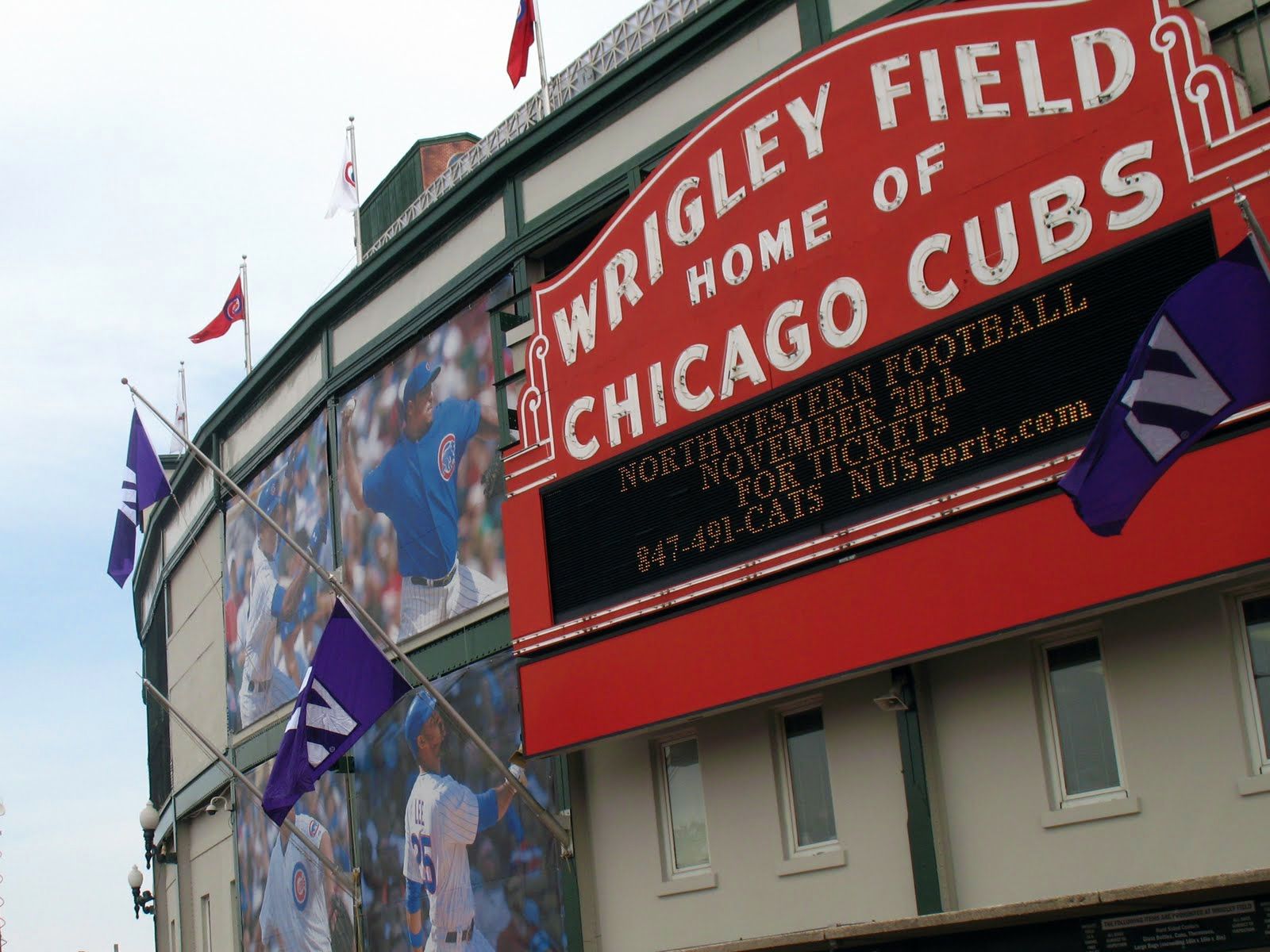 wrigley-field-entrance-sign-at-night - Baseball Brew Crew