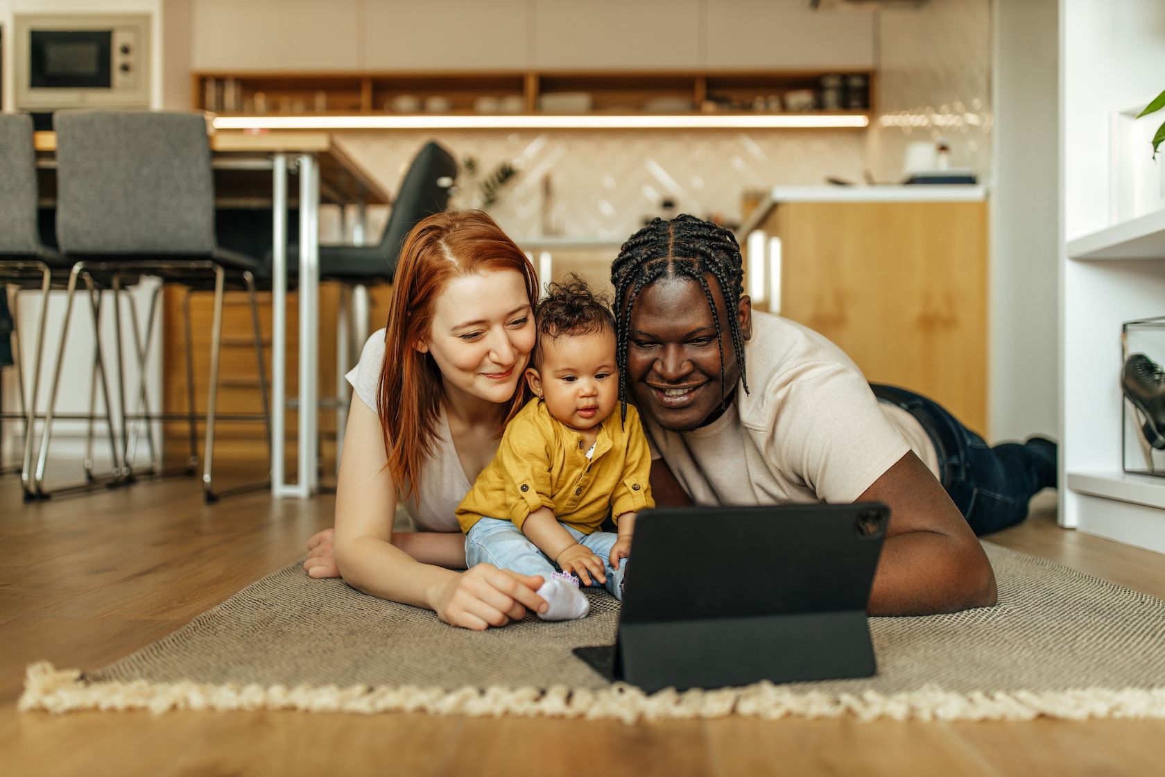 Young parents reviewing online resources