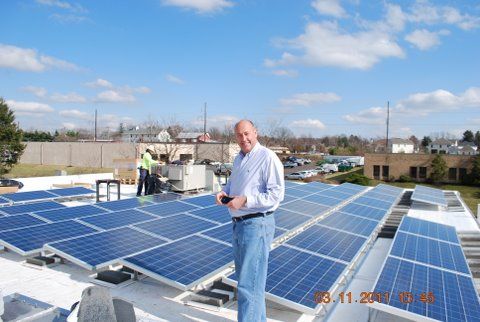 Solar Panel Photo with Darrel Standing
