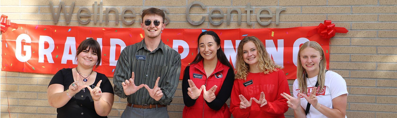 Students making W's with their hands.