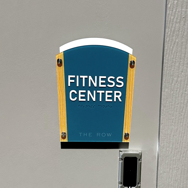 Custom ADA-compliant signs including restroom, wayfinding, and room identification signs for a medical office