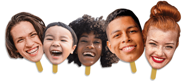 Five smiling faces cut out, various ages, genders and ethnicities, attached to handles