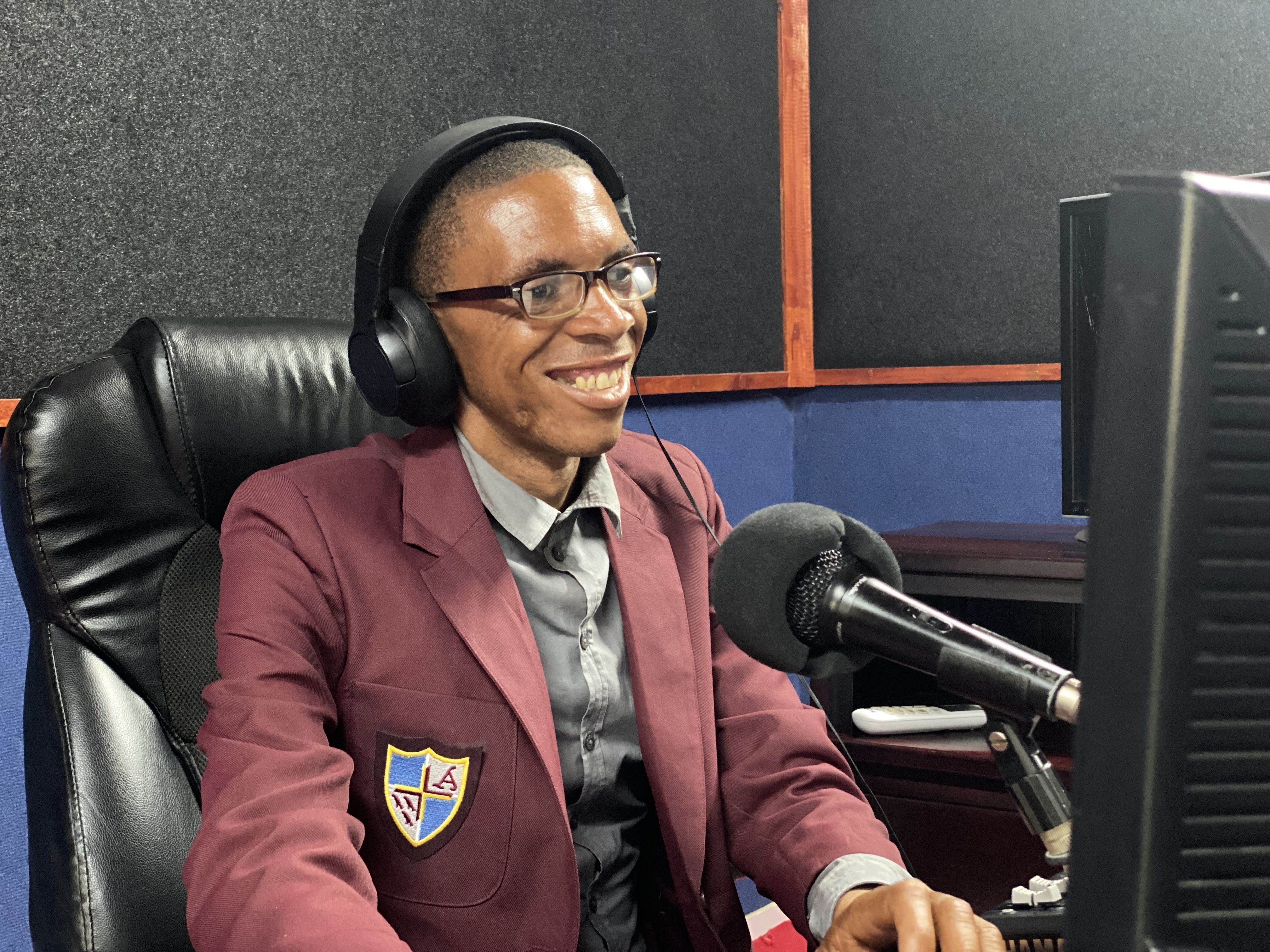 Male radio announcer at microphone