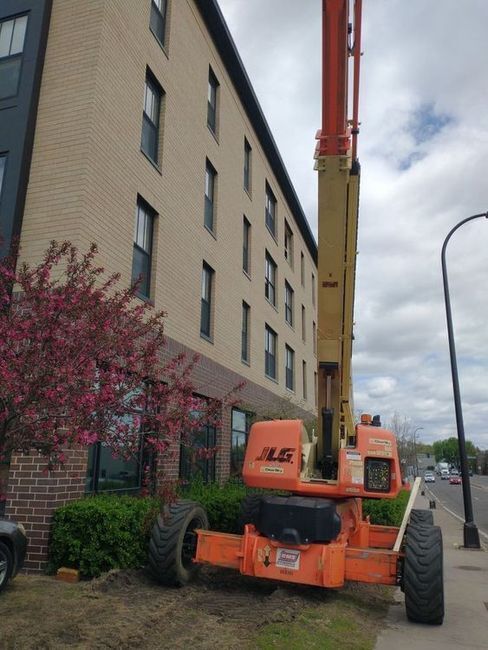 Construction equipment next to apartment building
