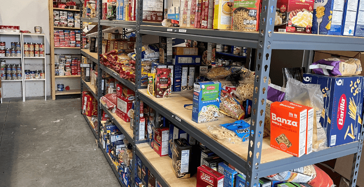 Boxed goods, canned food, and other non-perishable items sit on shelves at the Home for Families Resource Pantry