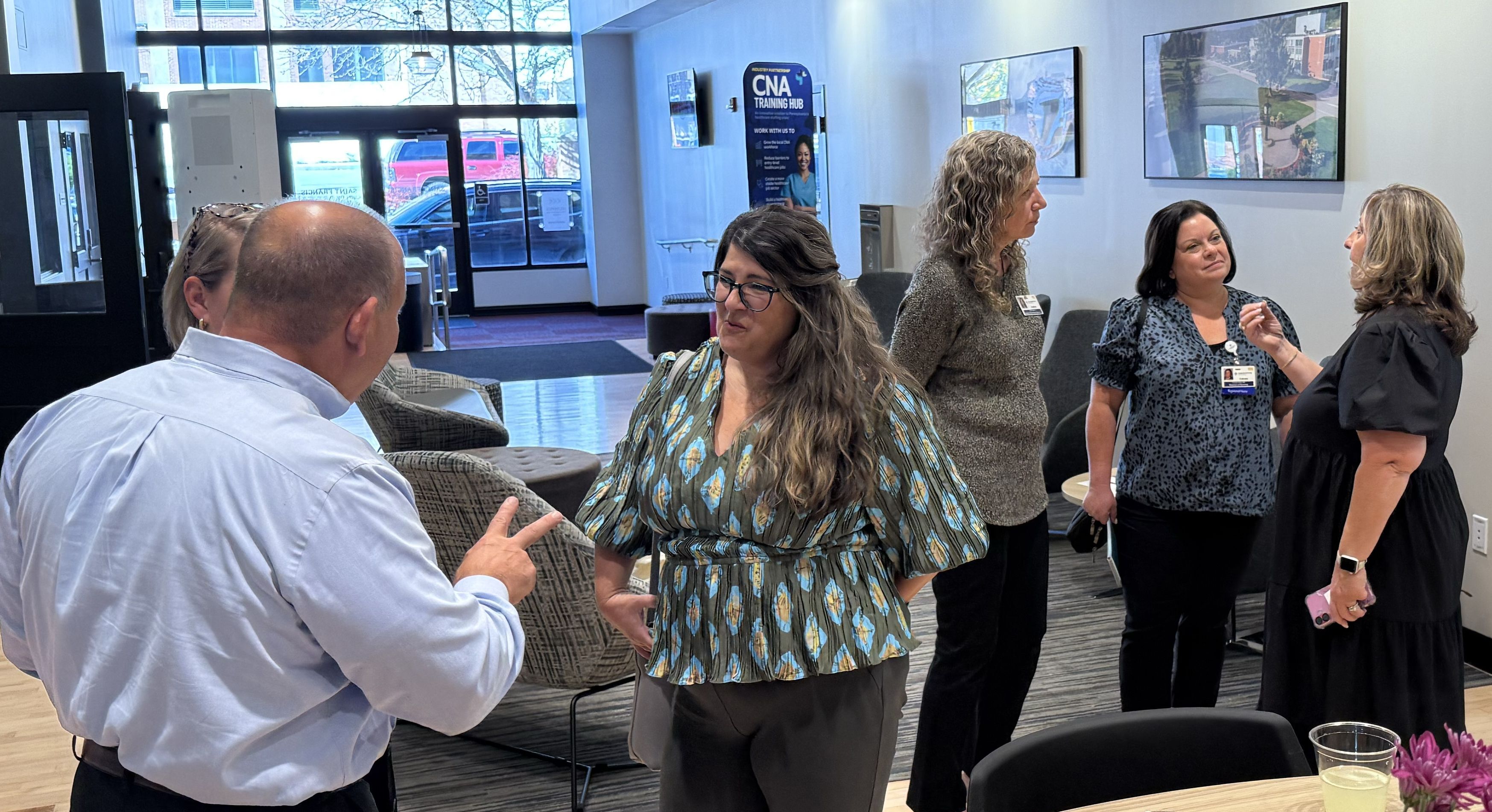 Training & Education Fund and SFU staff mingle with industry leaders and members of the public to discuss the new Laurel Highlands CNA Training Hub.