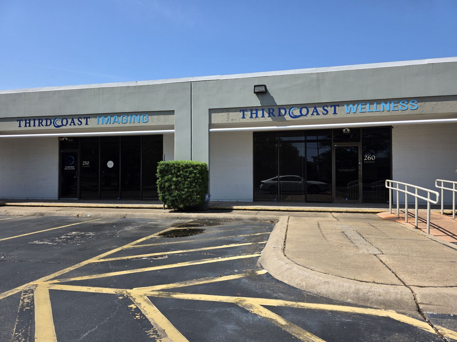 Acrylic dimensional letters installed on the exterior façade, using bold colors for visibility and branding.