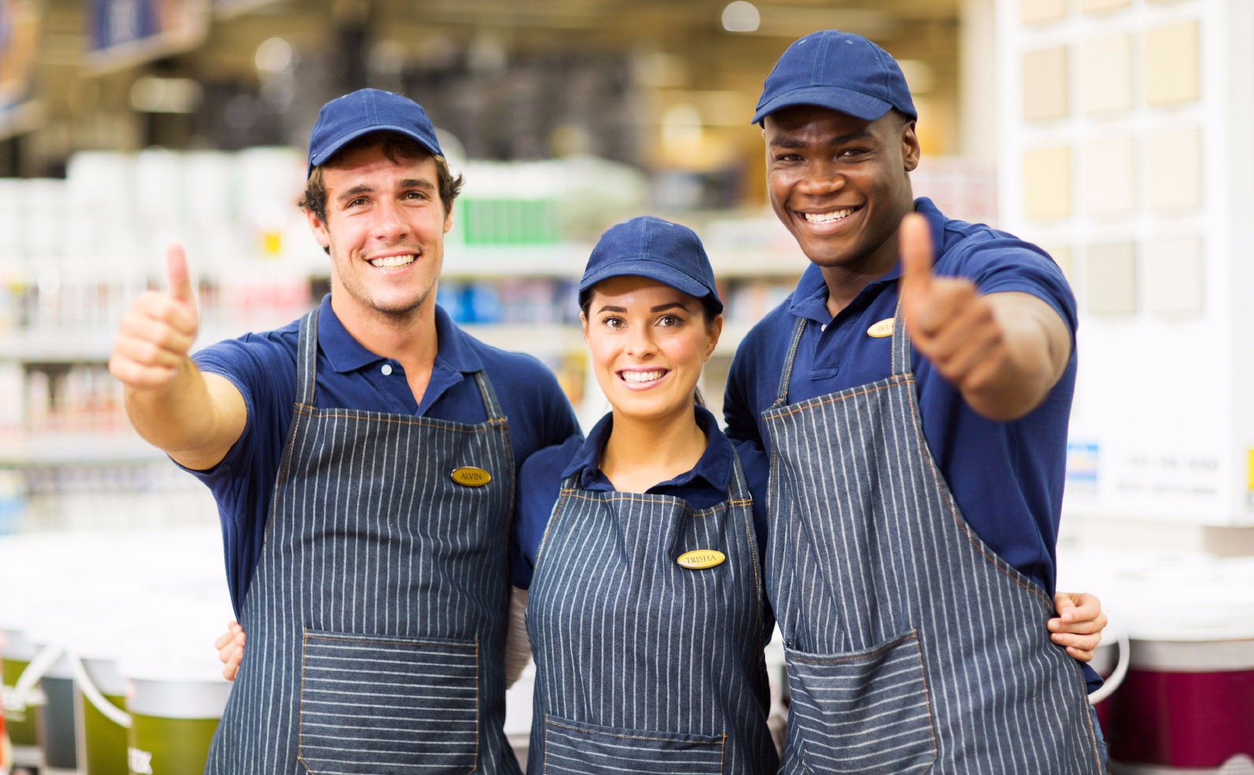 print shop employees giving thumbs up