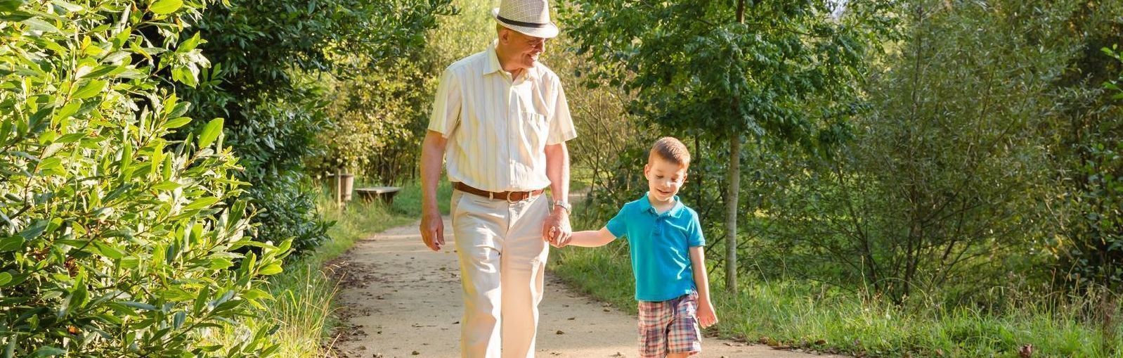 Grandfather and boy walking