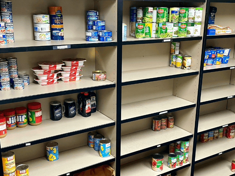 Bare shelves of IPC's Food Pantry