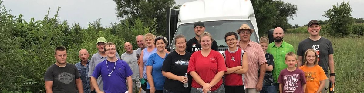 Volunteers who helped remove invasive Siberian Elm trees on the Dark Island Trail