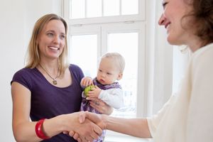 Parent working with child care provider