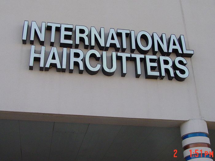 International Haircutters Storefront Sign