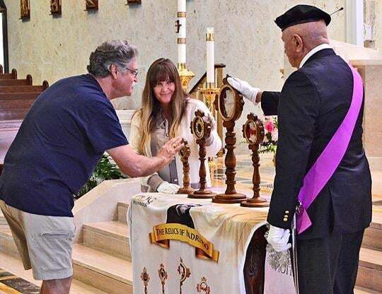 Pilgrim views relics of St. Pio