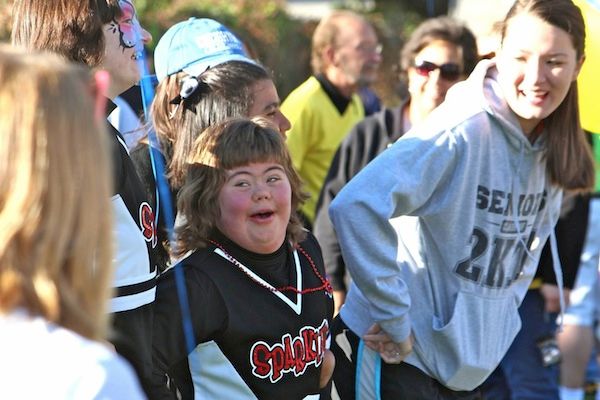 A girl with her family and supporters at a past Buddy Walk event.