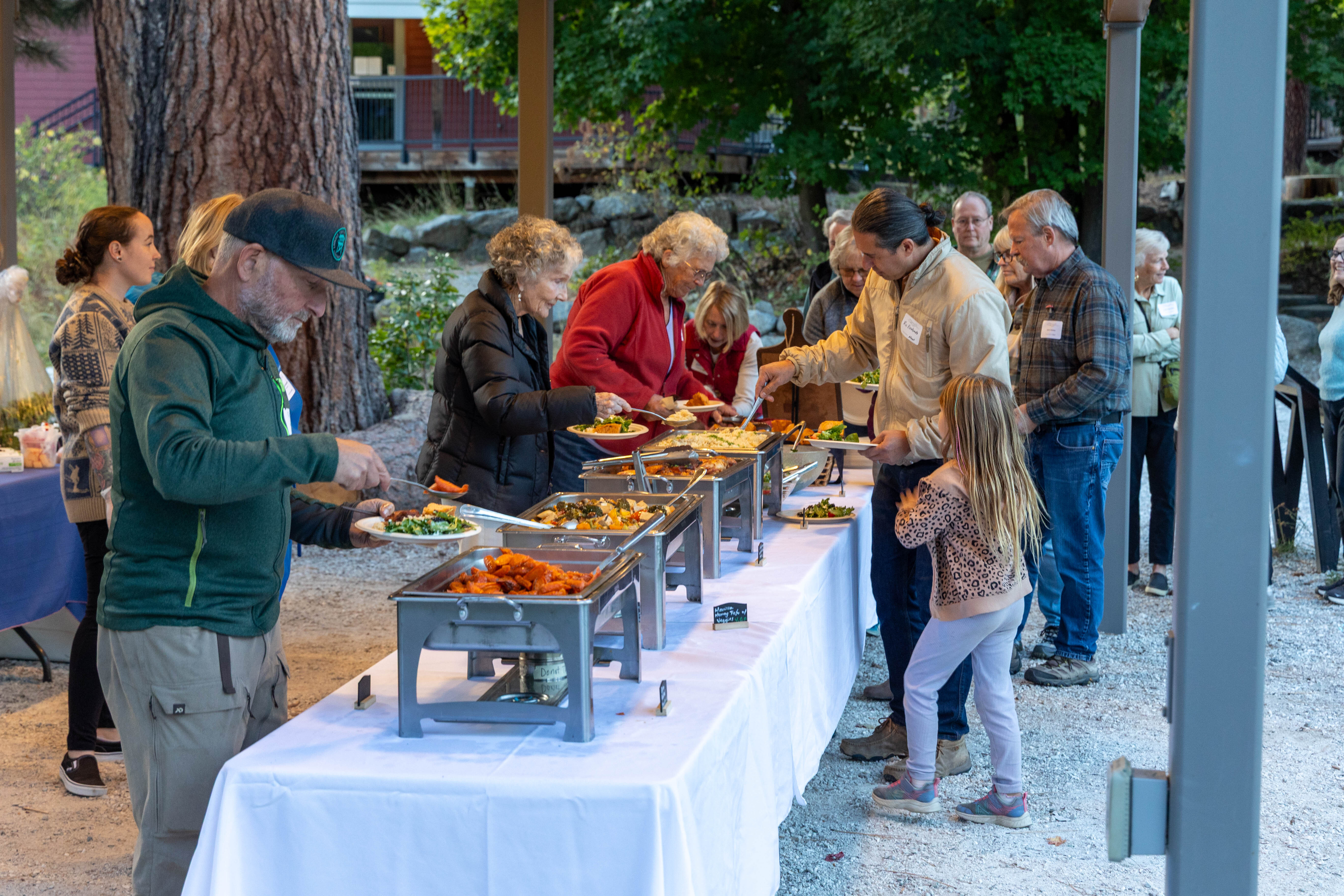 Sunset & S'mores 2026 participants going through the buffet line for dinner. Photo by Angela Crampton.