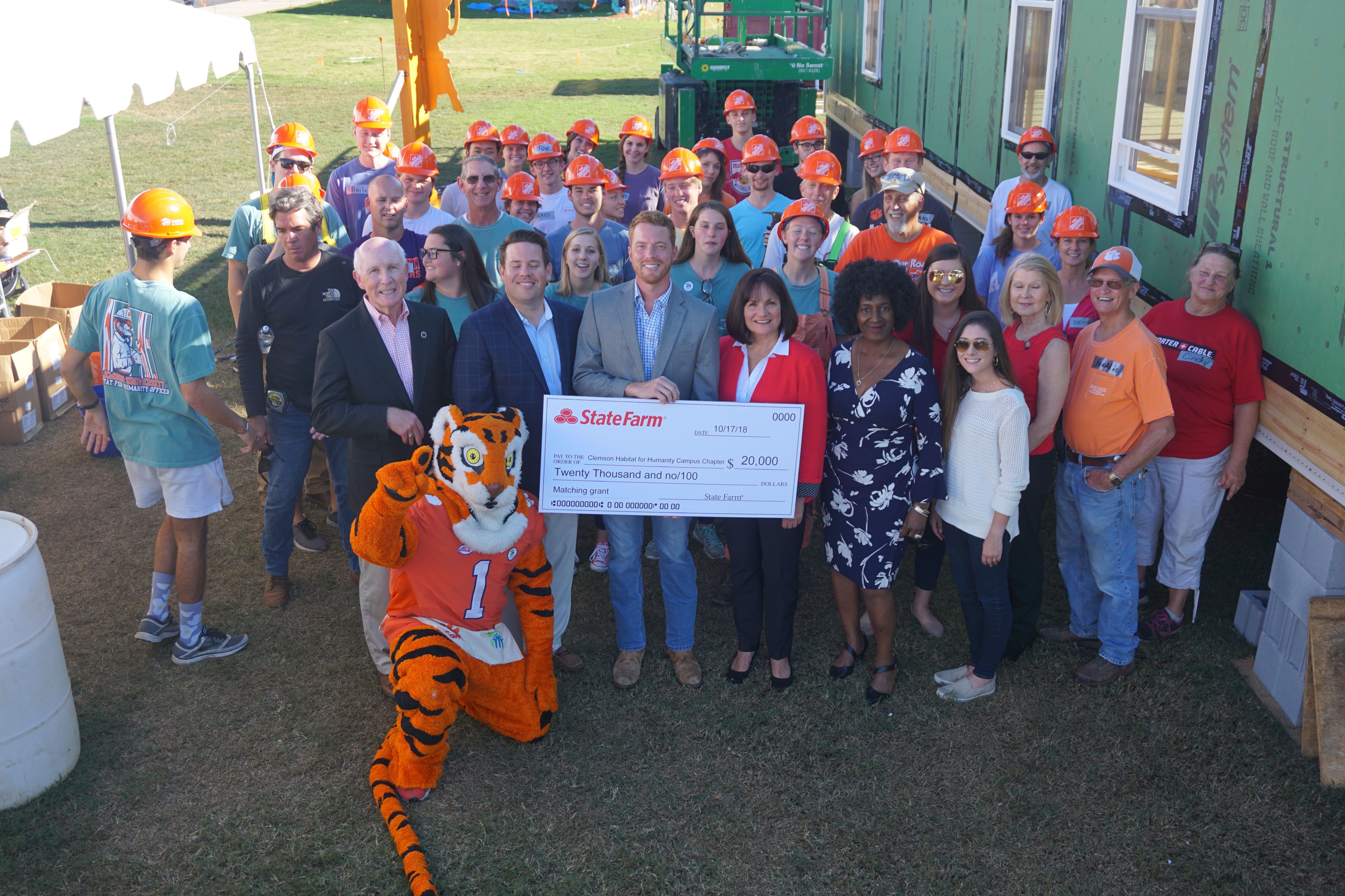 State Farm representatives, Tiger Mascot, and PCHFH staff along with Clemson Habitat students pose with $20,000 check