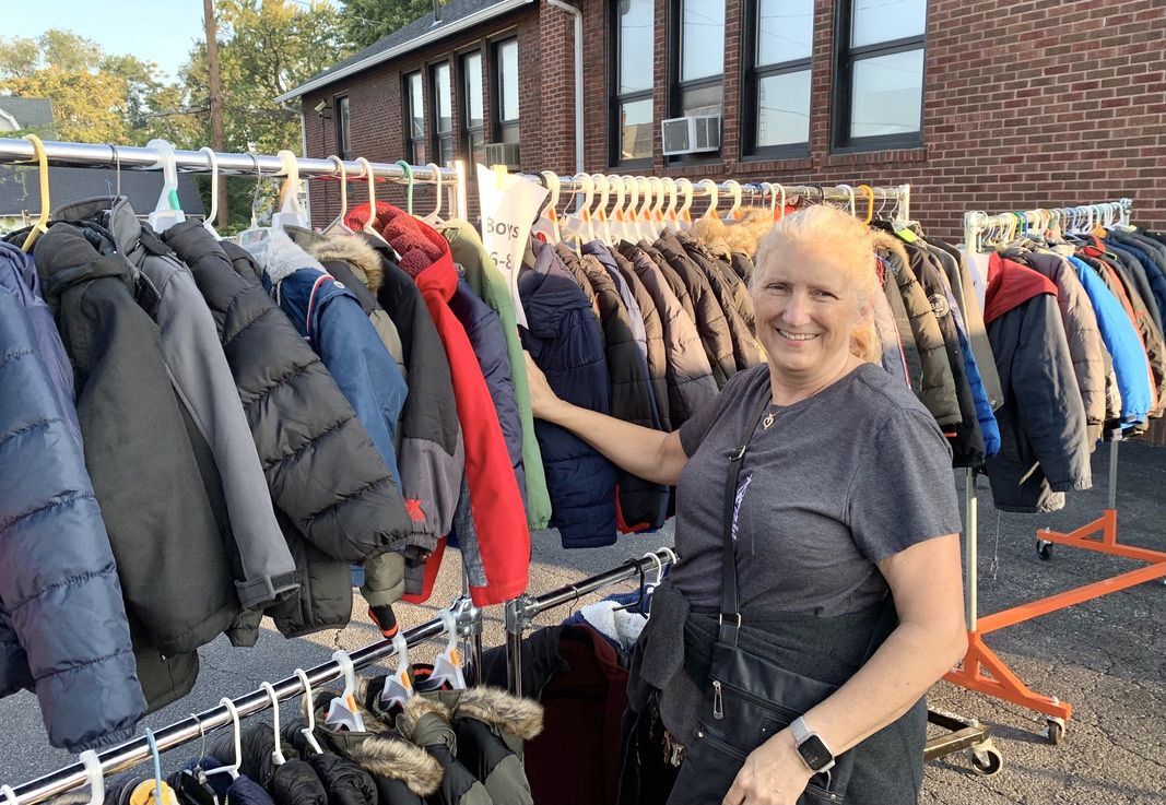 Sue Shrewsbery, Director of Helping Hands of St. Louis, organizes coats for the annual Winter Coat Fest.