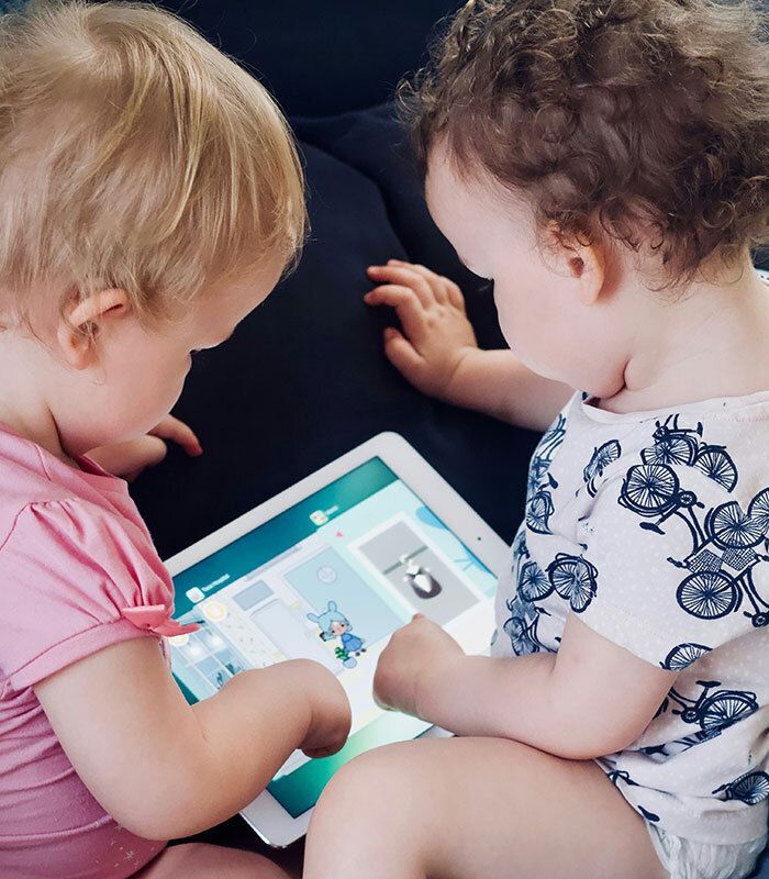 babies playing with tablet 