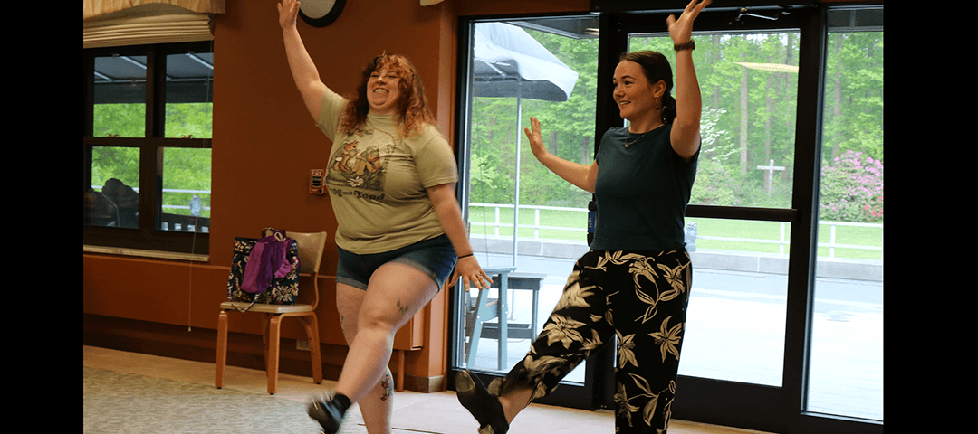 Hannah, on staff at the Art House, and Emily, who worked at the Art House, do a tap dance.