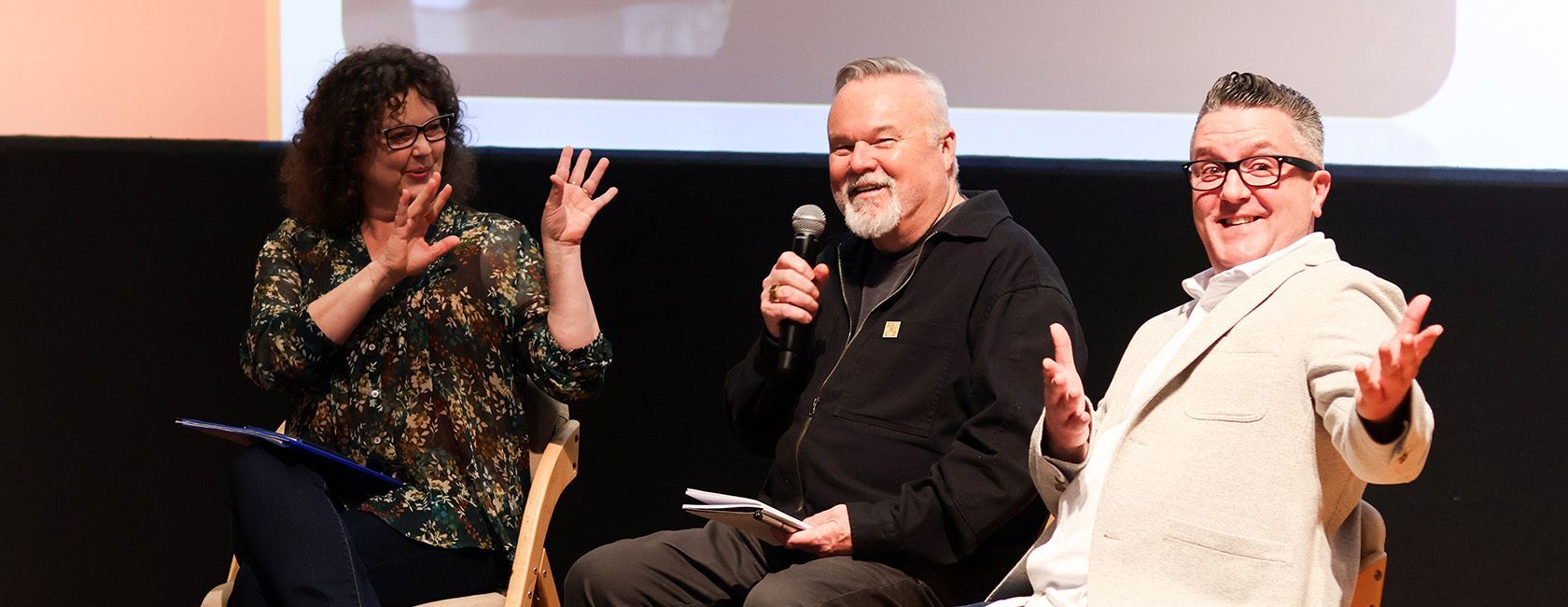 Group of people on stage presenting