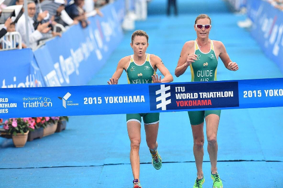 Katie Kelly crossing the finish line at a 2015 Yokohama Triathlon