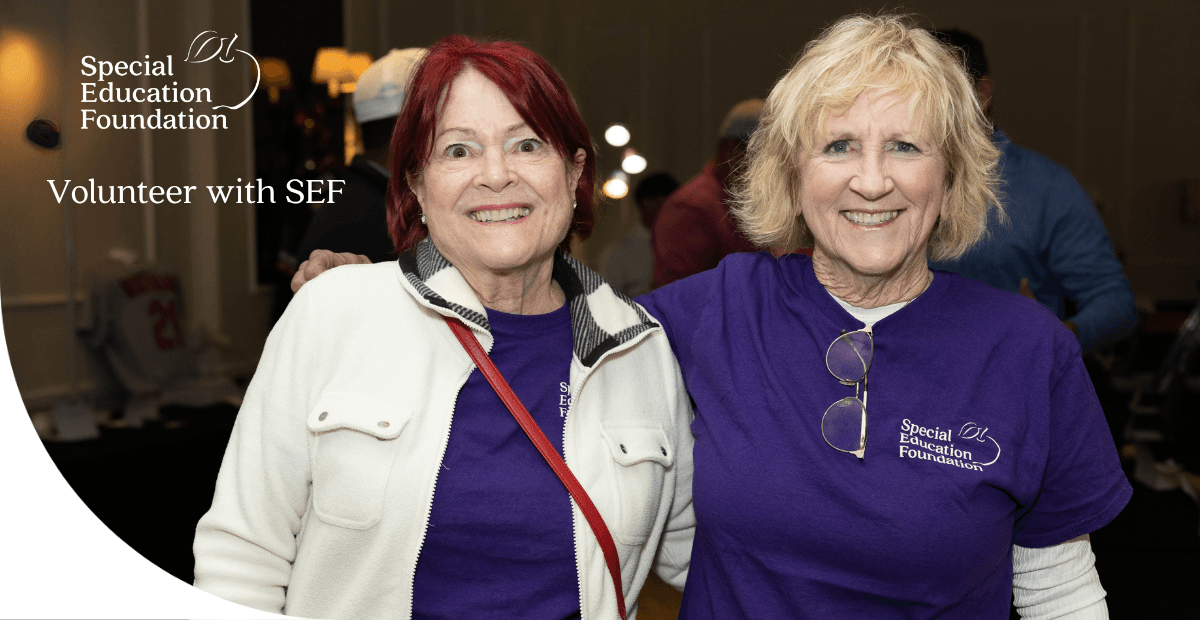 two ladies smiling with their arms around eachother