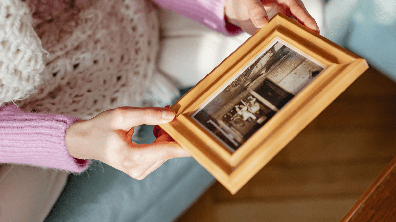 woman holding photo frame