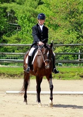 Photo depicts Dan Mohl, a Para-Dressage Fund grant recipient, riding his horse.
