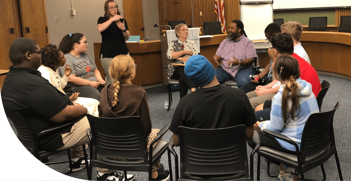 students sitting around a table 