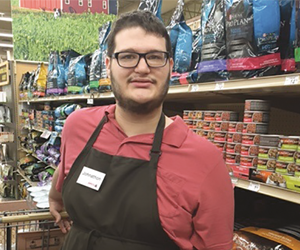 Young man working in pet store