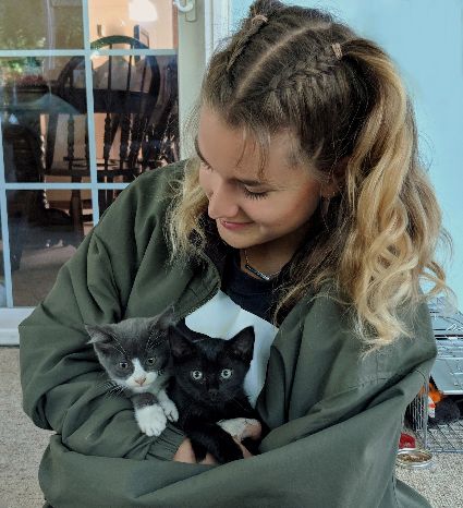 Tarina with the two kitties she rescued.