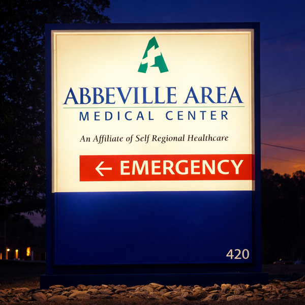Custom ADA-compliant signs including restroom, wayfinding, and room identification signs for a medical office