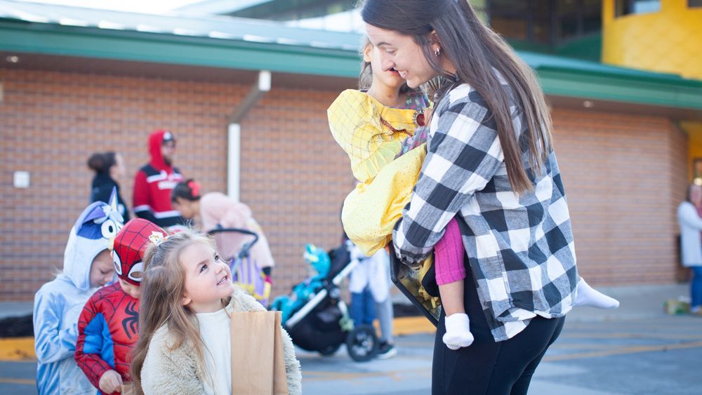 Staff and children lined up for Halloween fun