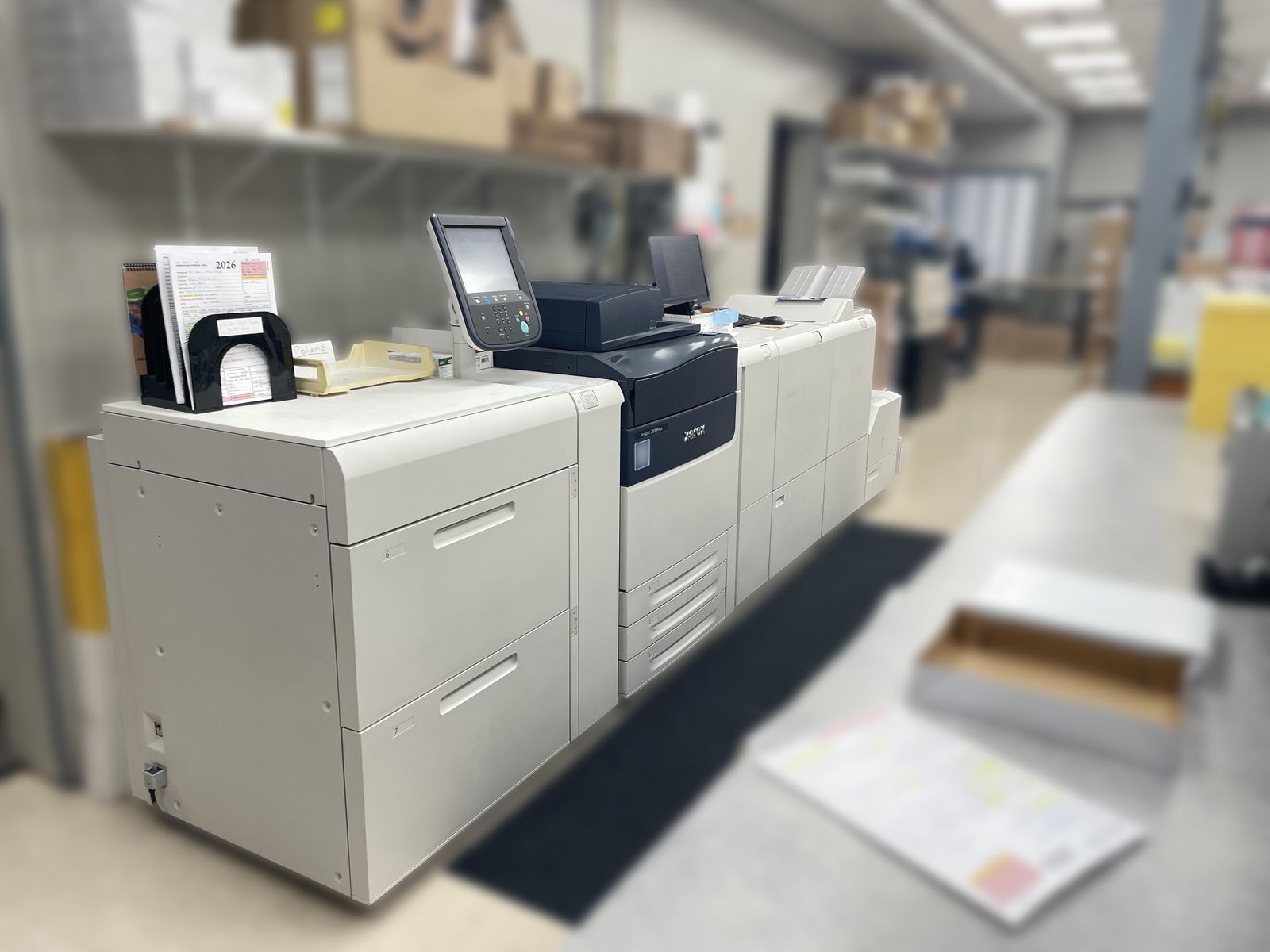 A long grey copier machine