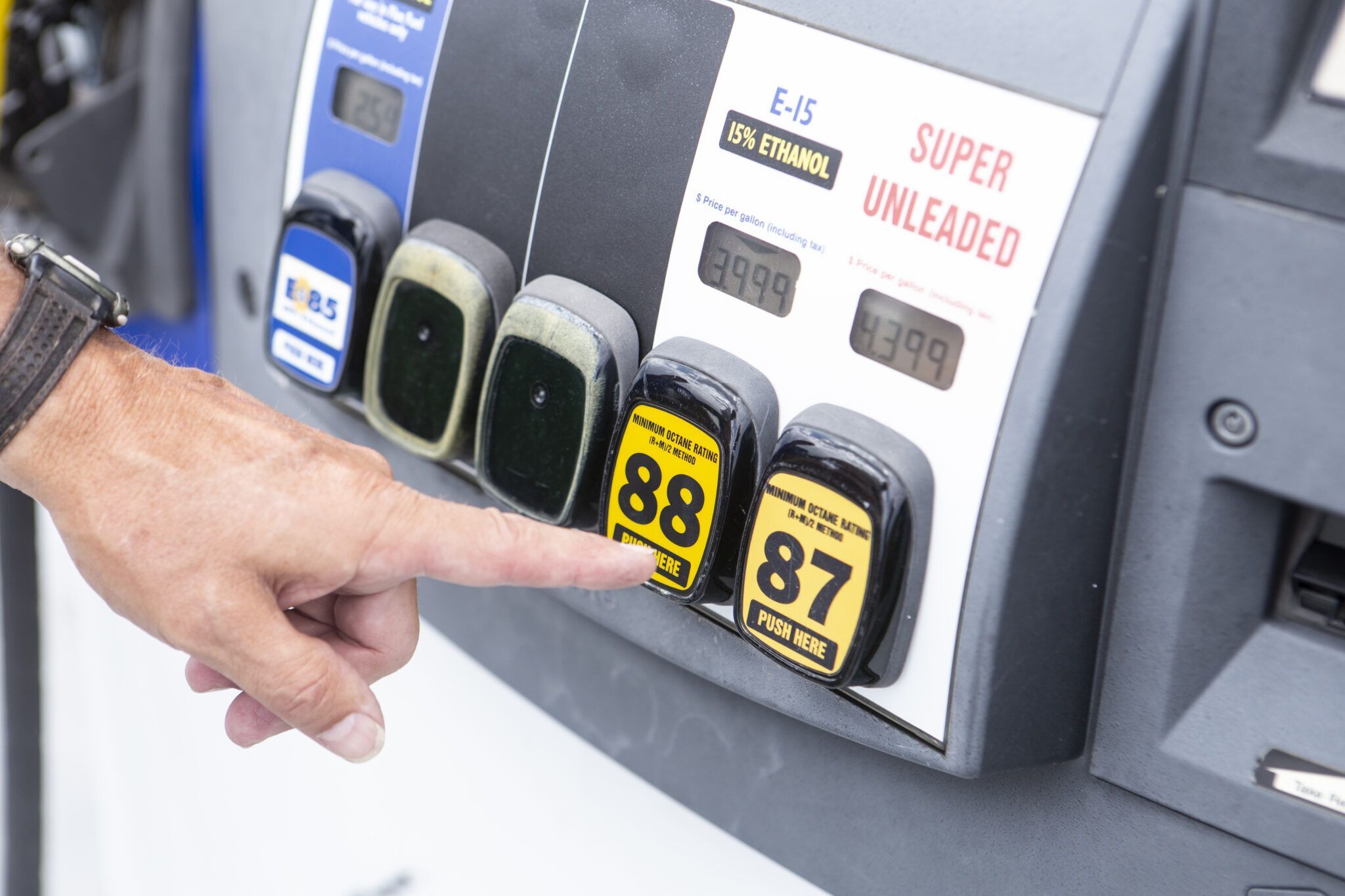 Selecting gas type at a gas pump.