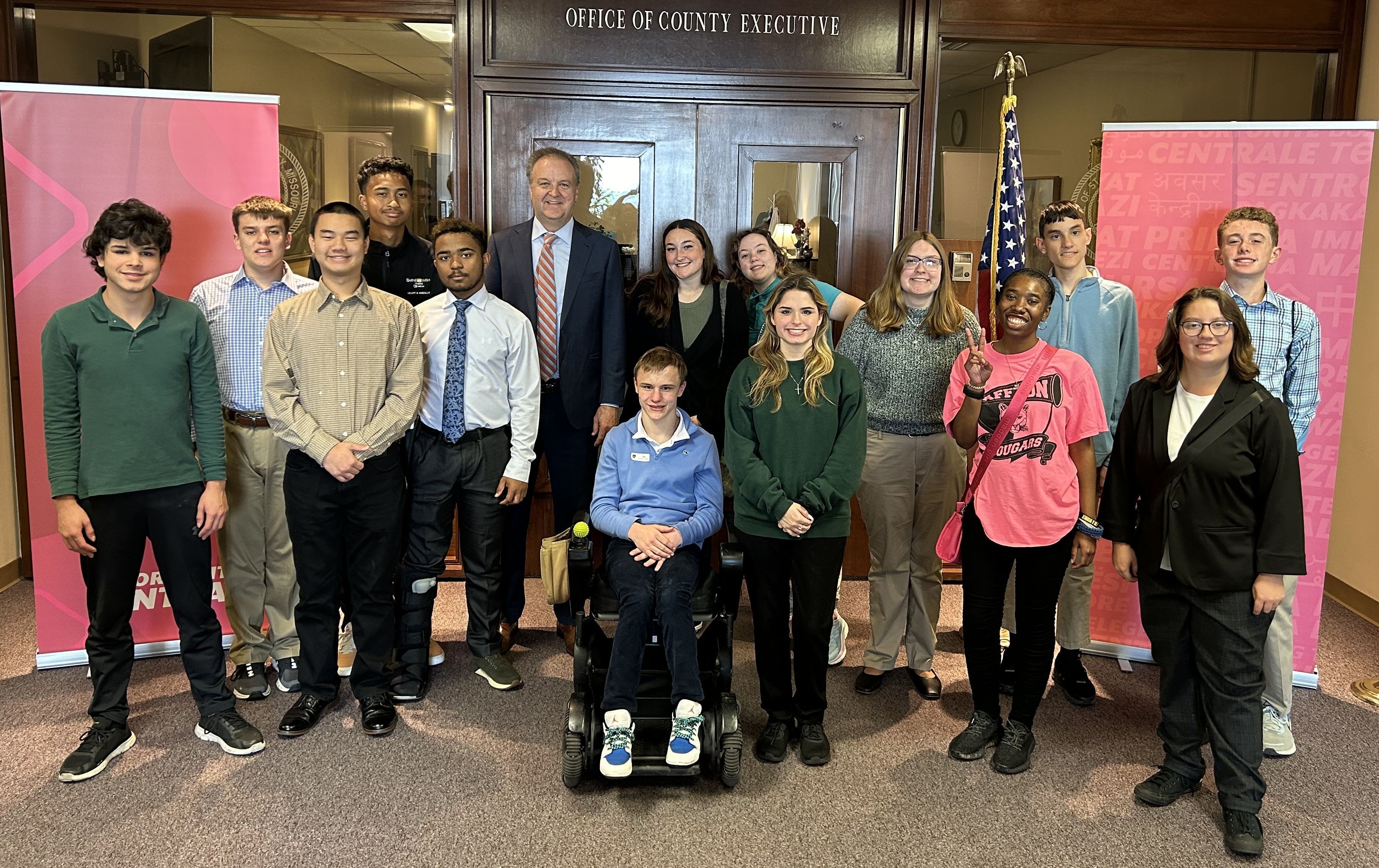 students dressed up and posing with county executive