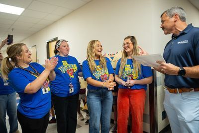 Education Foundation donor shaking hands with teacher