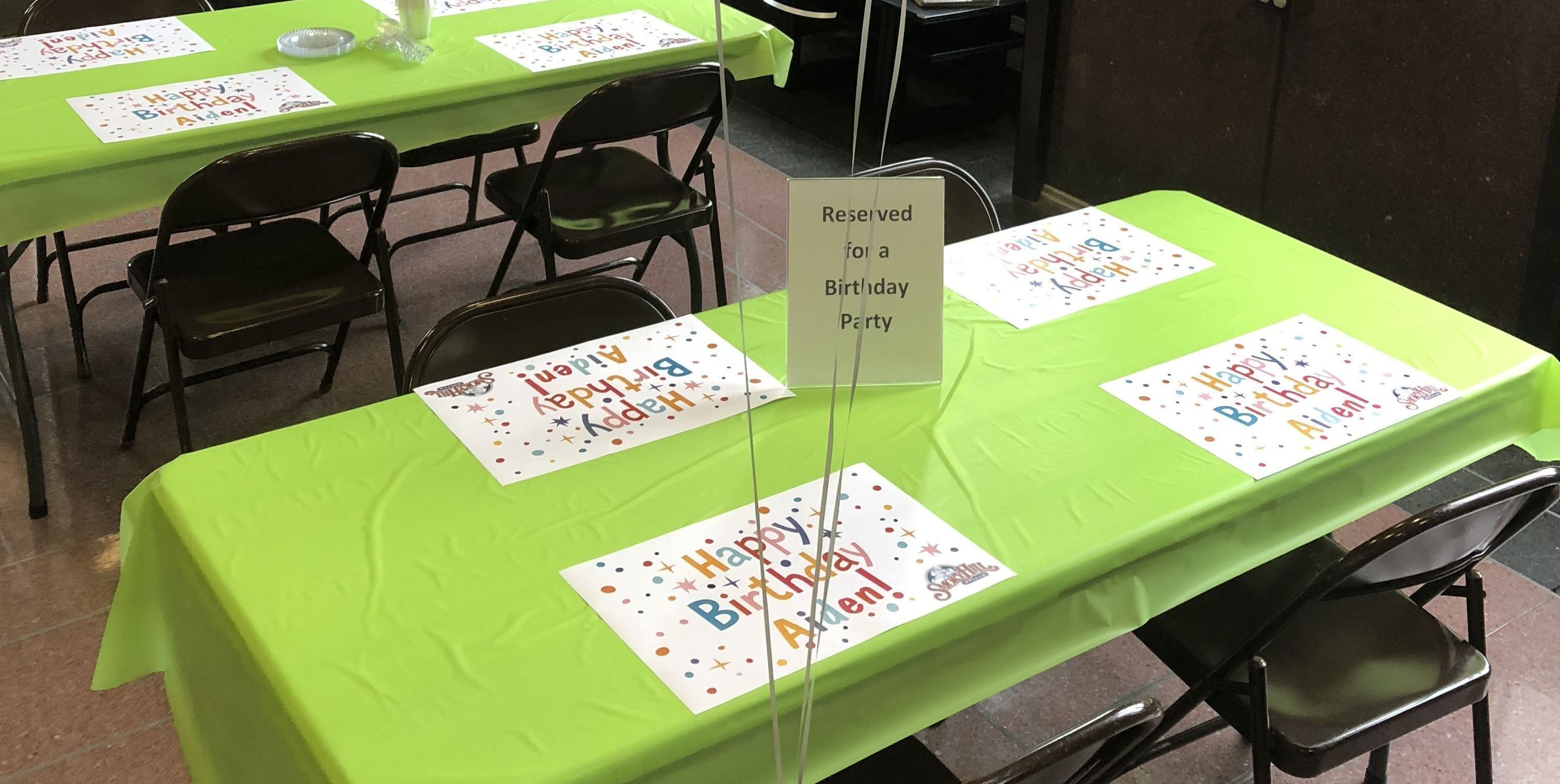 table in the Smoky Hill Museum lobby set up for a birthday party
