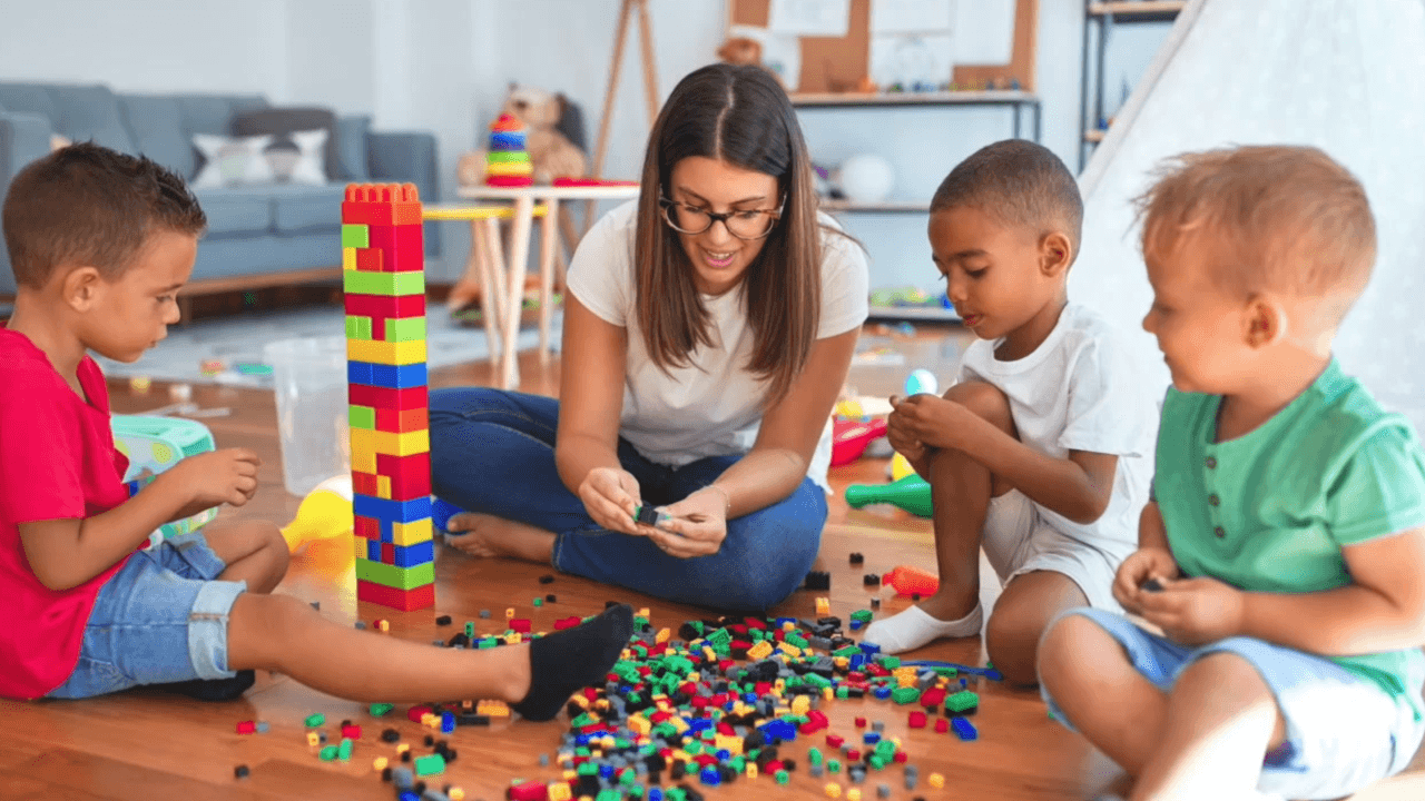 Woman with Children Holding Different Color Bells