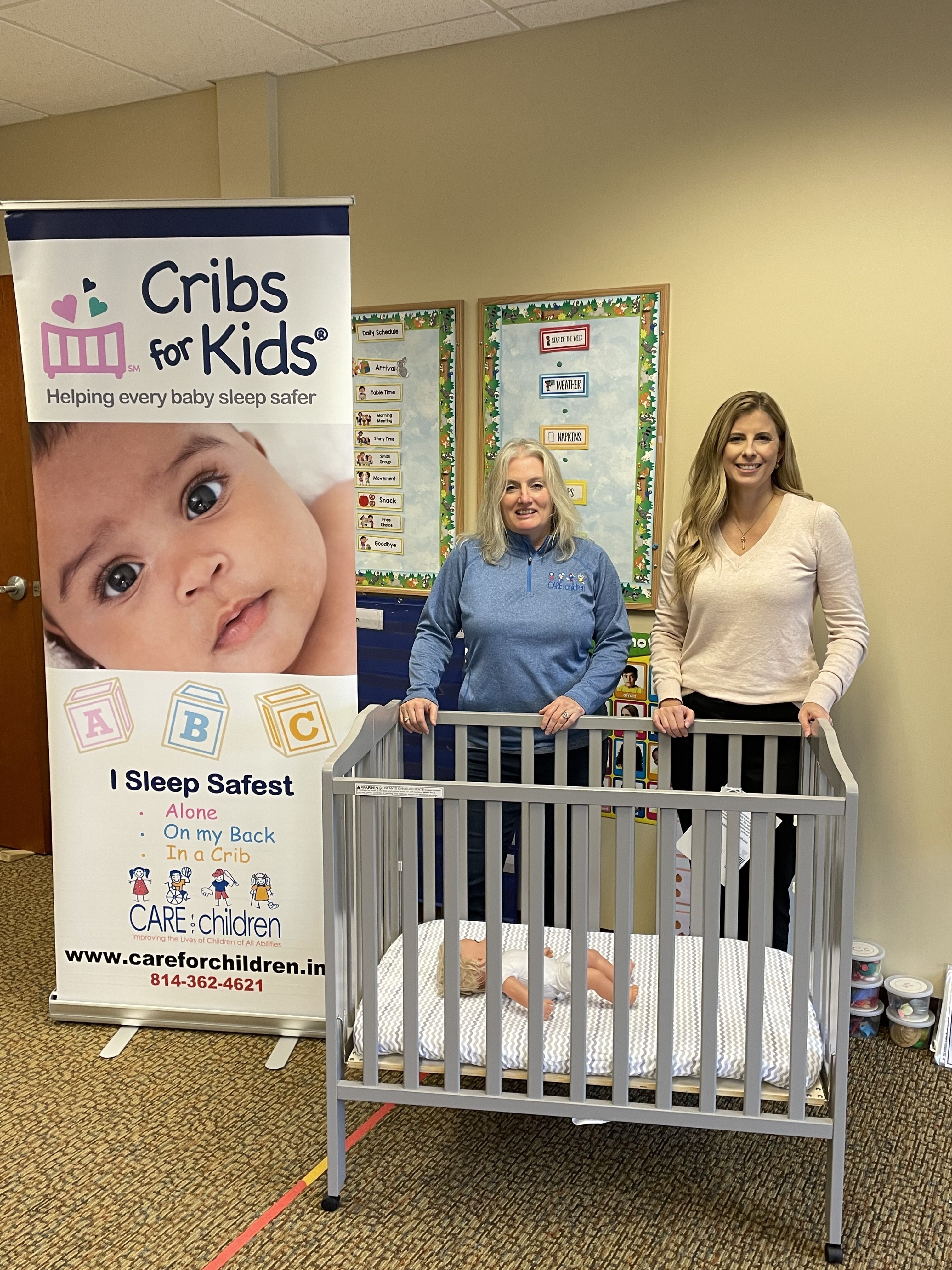 Joy Haney and Laura Whitford with Mini Crib