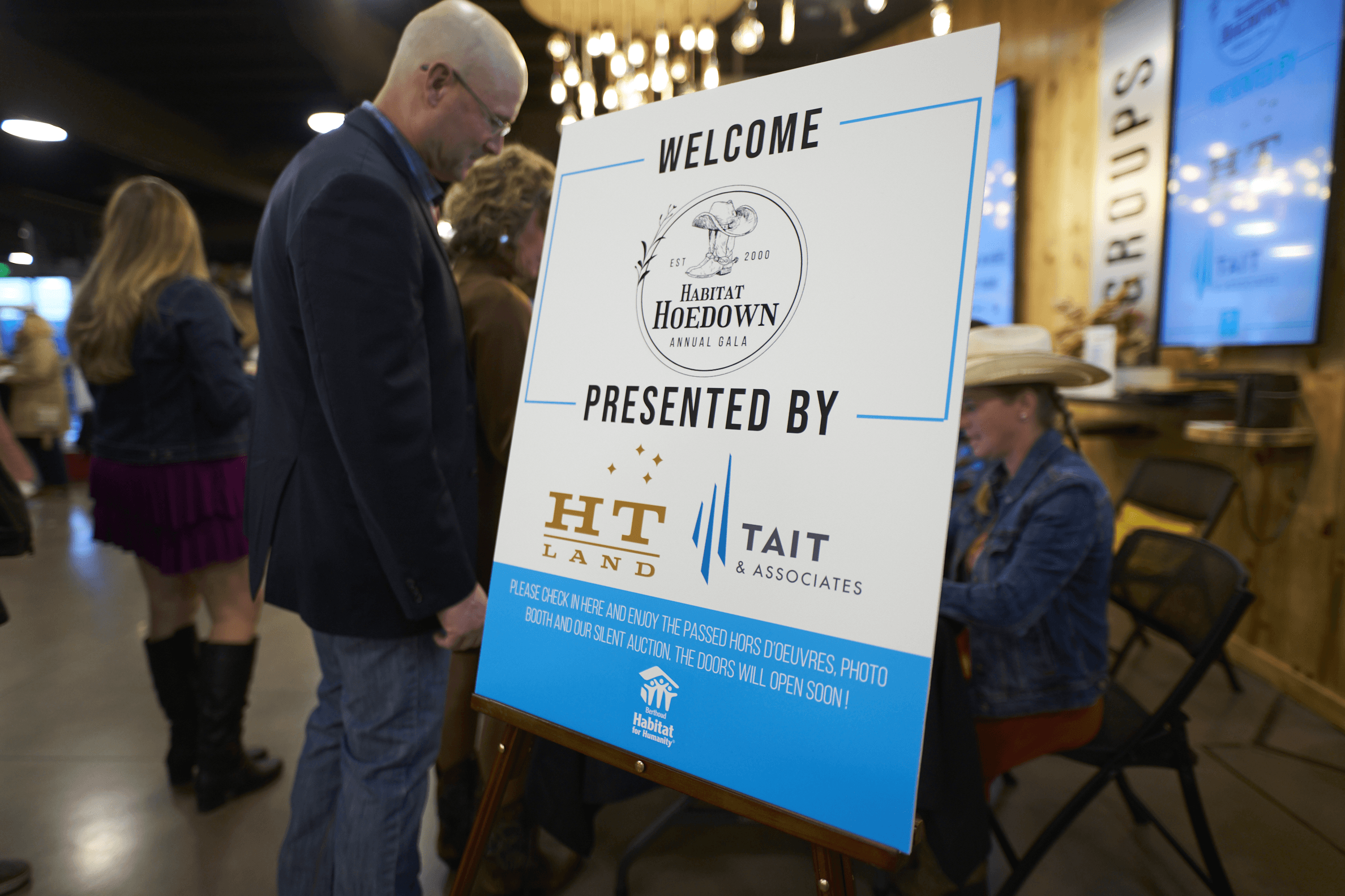 Habitat 2024 Presented by HT land and Tait and Associates sign.