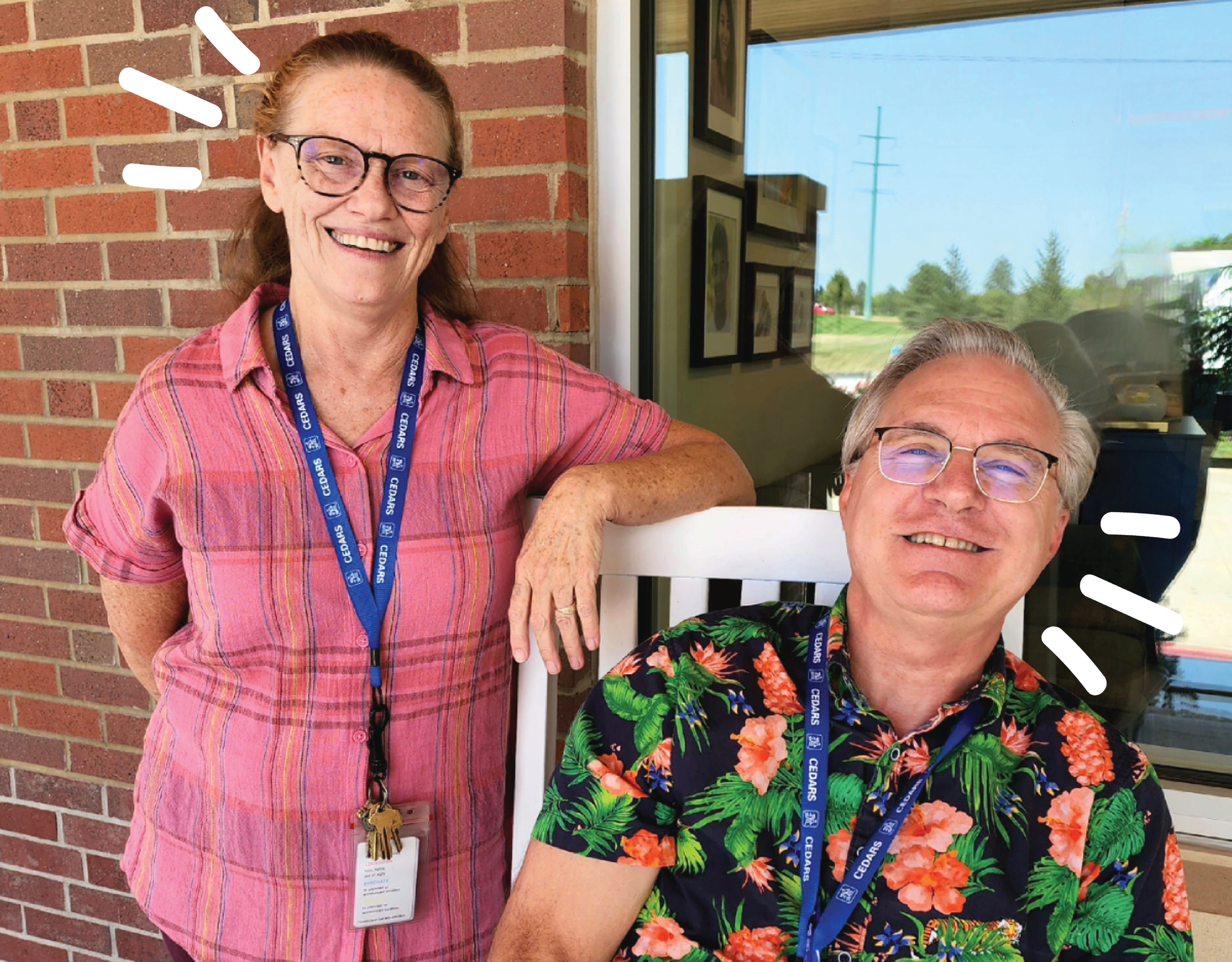 Photo of man sitting in rocking chair and woman standing to the left and leaning against chair framed in sparks. Left-aligned text in yellow and green boxes that read "staff spotlight, education team" next to the CEDARS branded logo. 