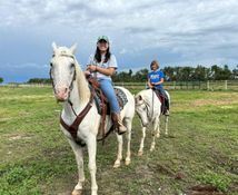 Lesley Liao rides a horse in South Dakota.