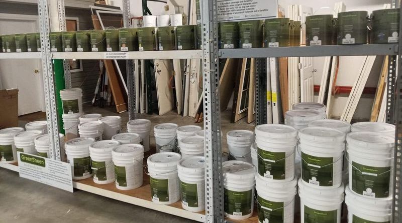 Shelves stocked with GreenSheen recycled latex paint at Habitat ReStore Zephyrhills – eco-friendly interior and exterior paint in quart and 5-gallon sizes